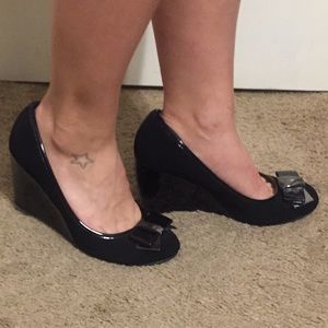 Professional black closed toe wedges